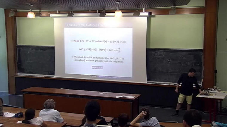 Harmonic quasi-isometries between negatively curved manifolds