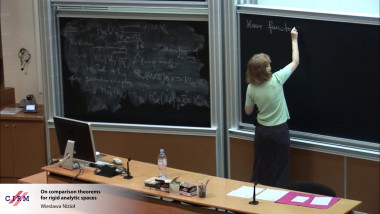 On comparison theorems for rigid analytic spaces