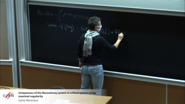 Uniqueness of the Boussinesq system in critical spaces using maximal regularity