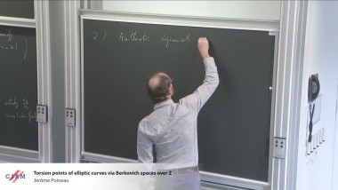 Torsion points of elliptic curves via Berkovich spaces over $\mathbb{Z}$
