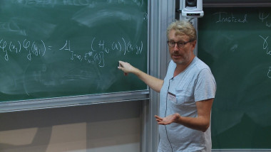 1/3 Large systems of interacting quantum particles in a random field