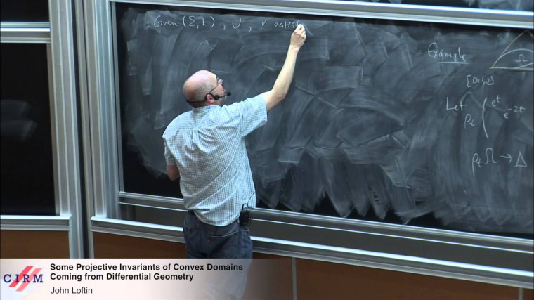Some projective invariants of convex domains coming from differential geometry