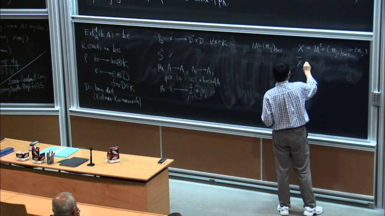 Nakayama automorphism and quantum group actions on Artin-Schelter regular algebras