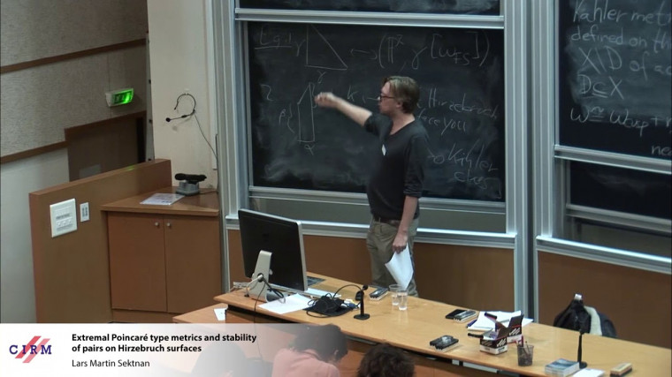 Extremal Poincaré type metrics and stability of pairs on Hirzebruch surfaces