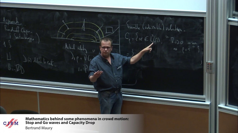 Mathematics behind some phenomena in crowd motion : Stop and Go waves and Capacity Drop