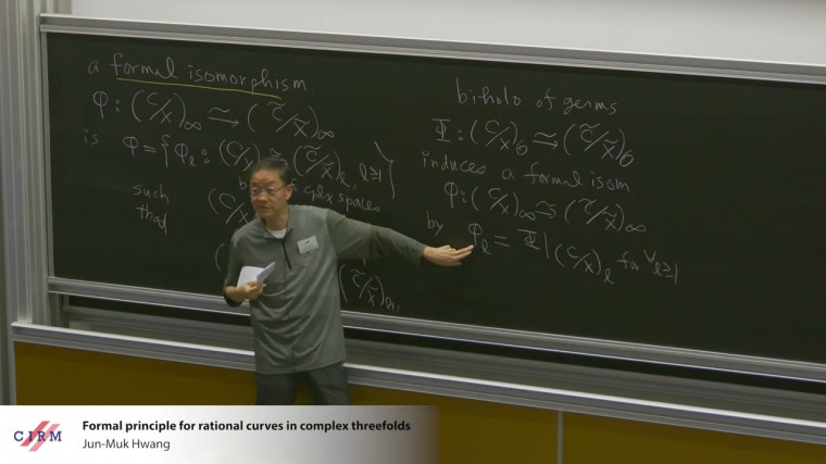 Formal principle for rational curves in complex threefolds