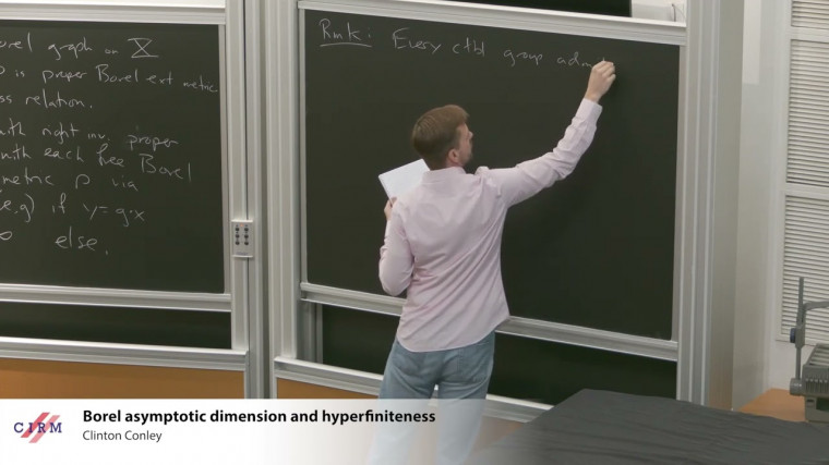 Borel asymptotic dimension and hyperfiniteness