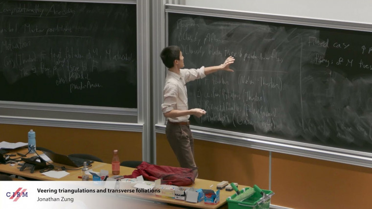 Veering triangulations and transverse foliations