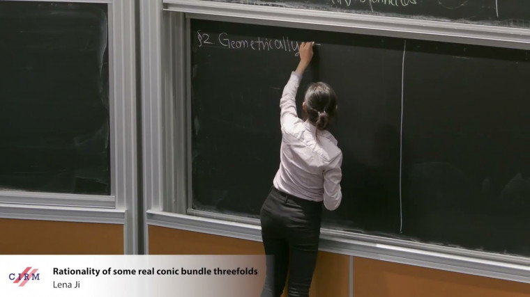 Rationality of some real conic bundle threefolds