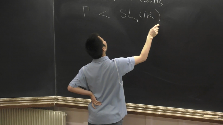 Local rigidity of higher rank lattice actions on flag manifolds - Part 1