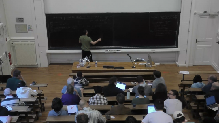 Stationary probability measures on projective spaces