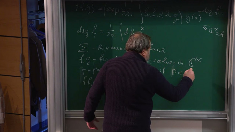Steinberg symbol and tau function
