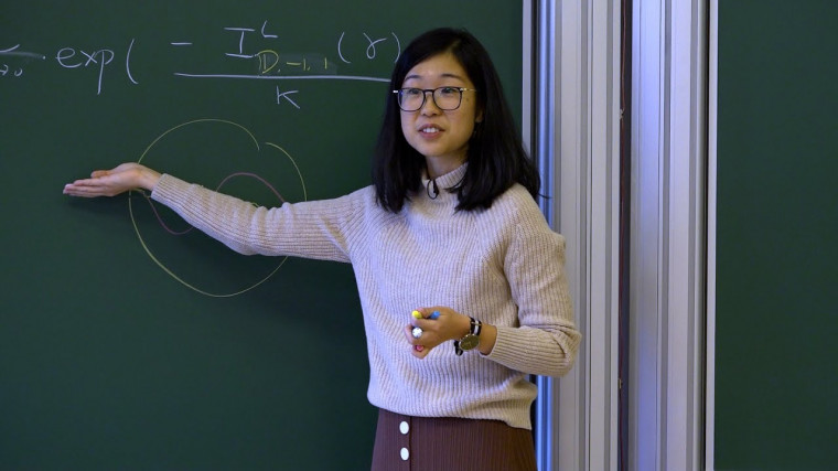 The Loewner Energy at the Crossroad of Random Conformal Geometry and Teichmueller Theory (2/4)