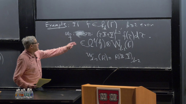 Modular Symbols, K-theory, and Eisenstein Cohomology