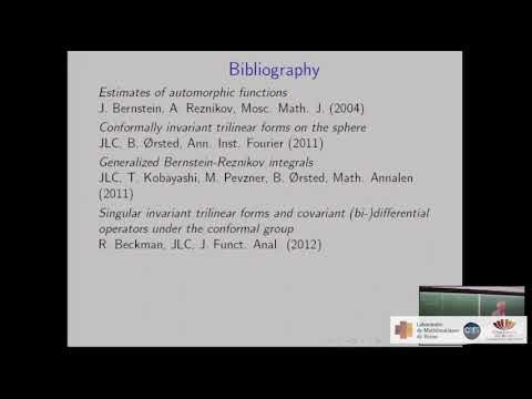 Conformally covariant trilinear forms on the sphere